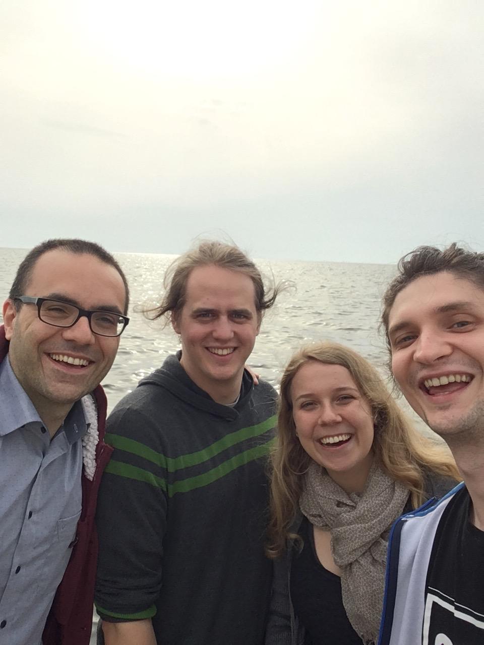 The EtherTrust-Team (Matteo, Niklas, Clara, Ilya) at the sea inThessaloniki